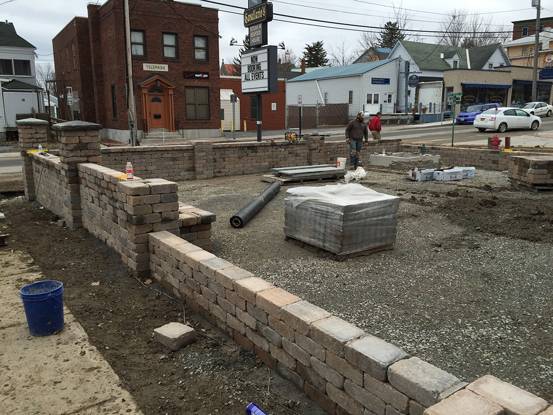 Walls Up, It's Time To Level Ground for the Pavers