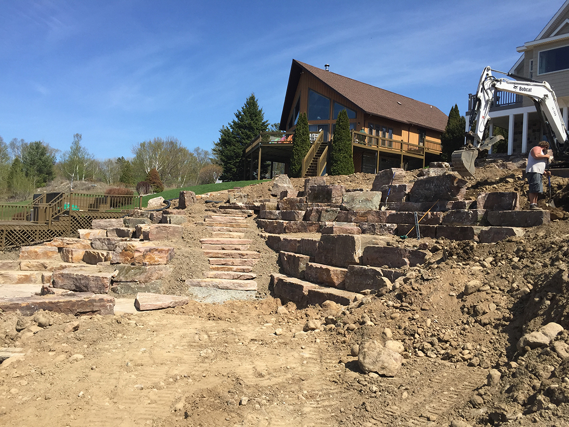 Hillside Taking Shape as Patios and Stairs are Built