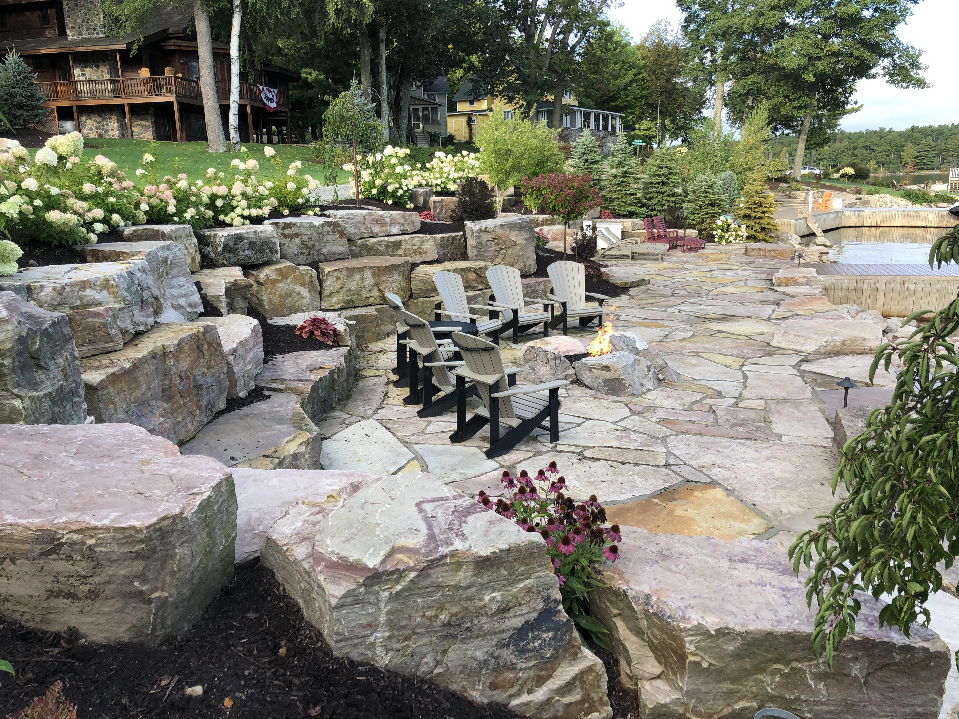 Flagstone Patio with Boulder Walls and Gas Fire Pit