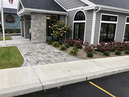 Paver Entry with Limestone Columns and Foundation Plantings