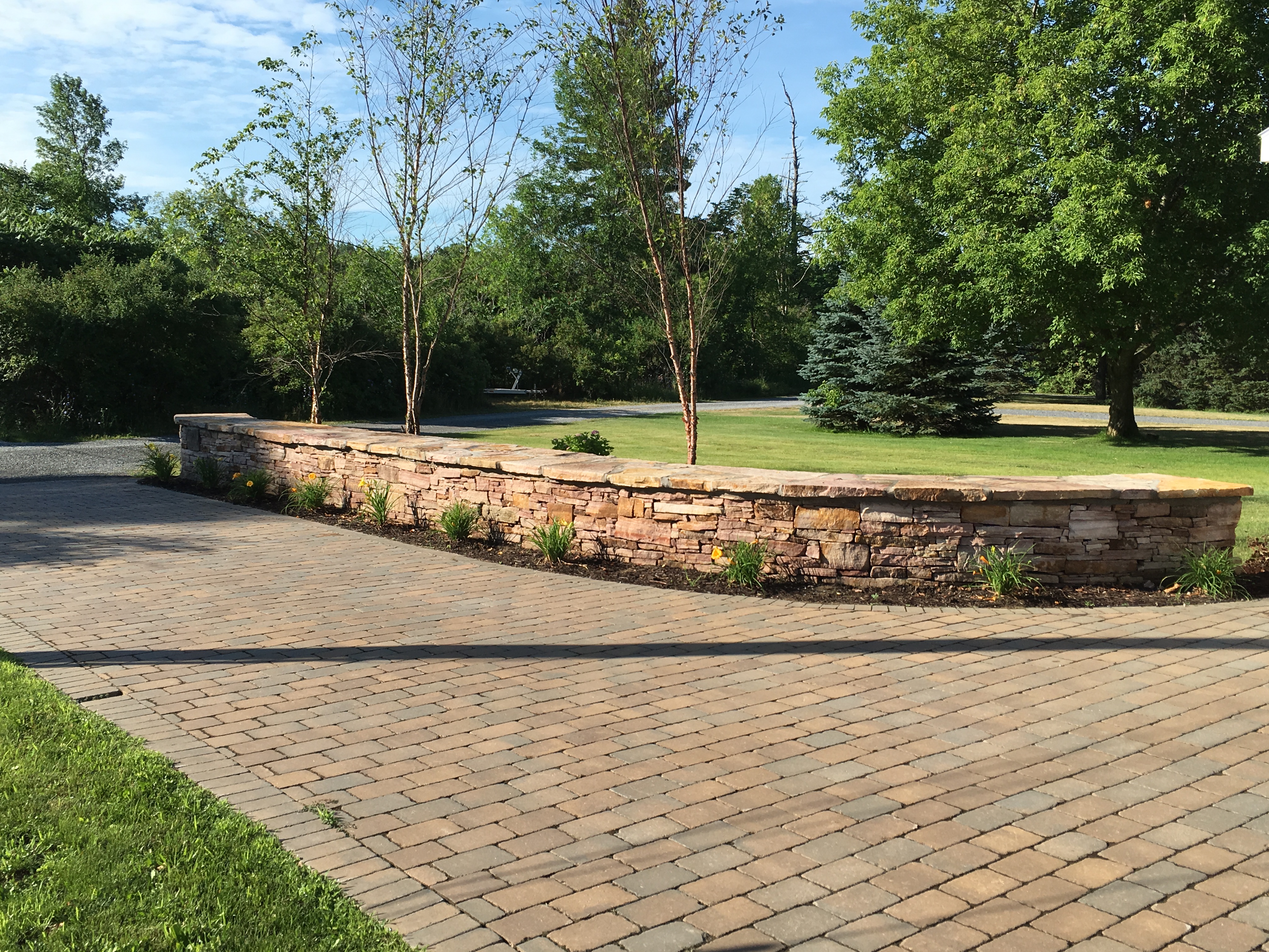 Stack Stone Wall with Paver Drive